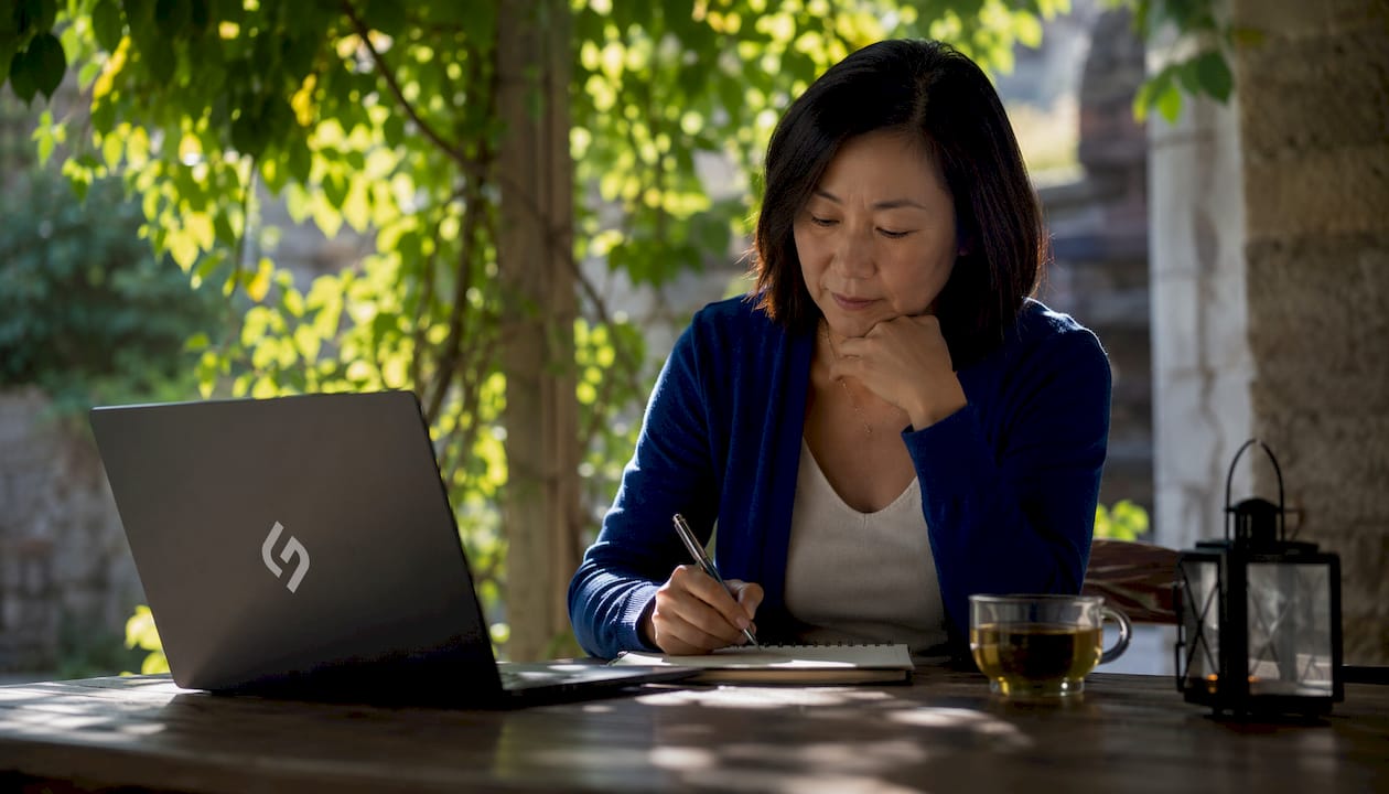 Product Owner prioritizing backlog at desk
