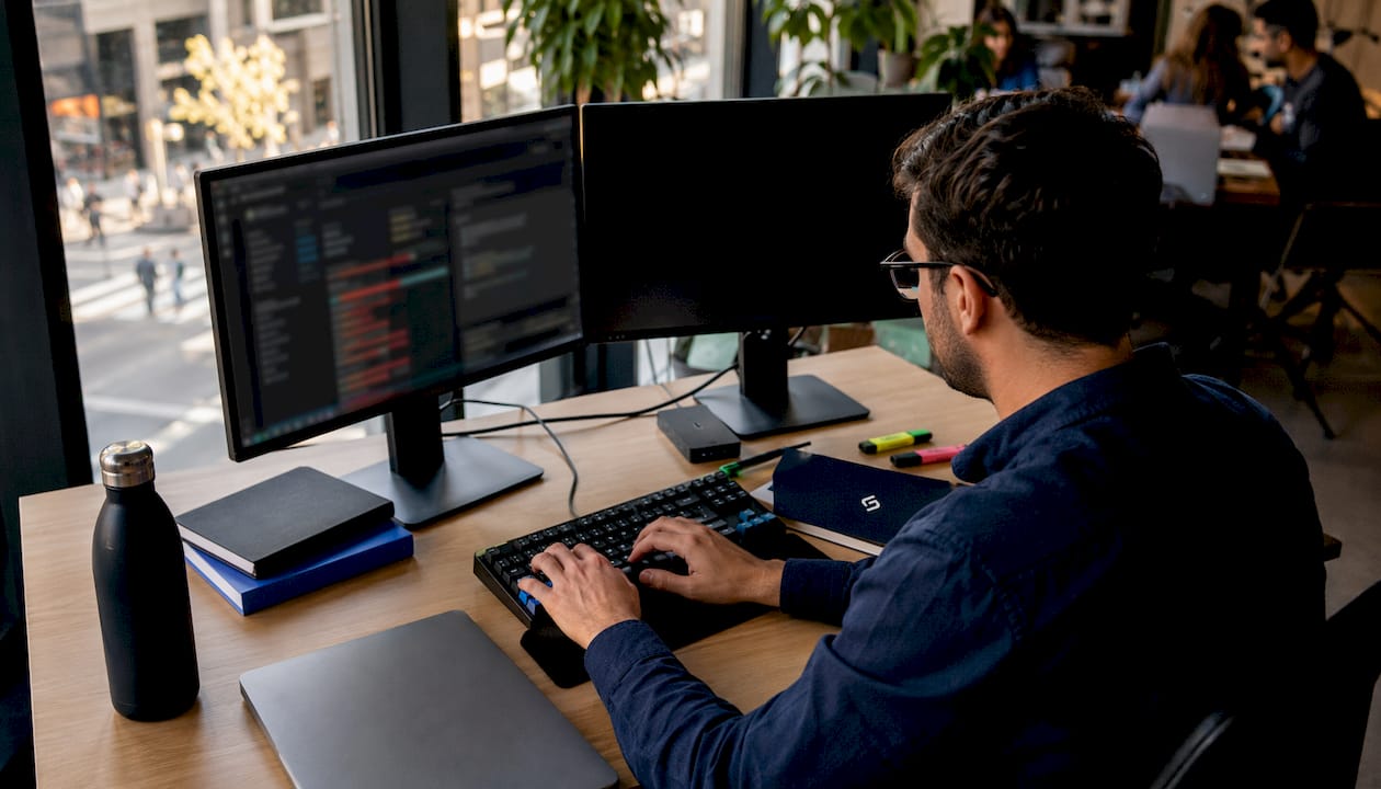 Hands typing SEO audit report