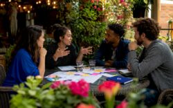 Team discussing communication around table in office