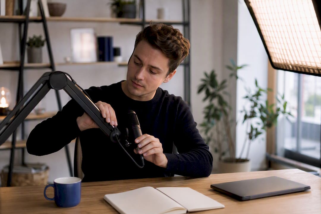 Content creator adjusting microphone for video shoot
