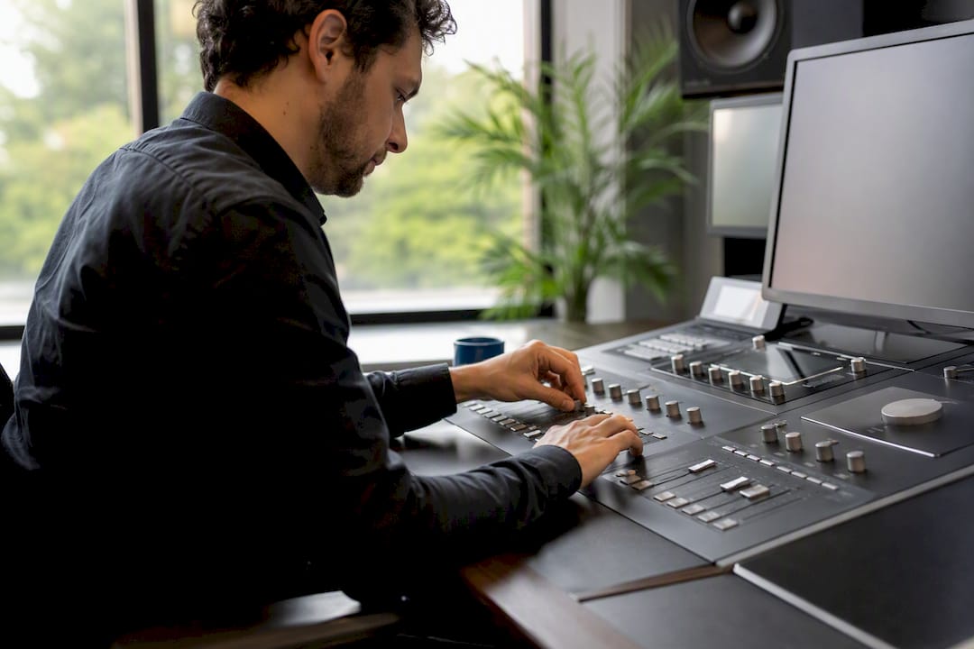 Hands calibrating analytics console