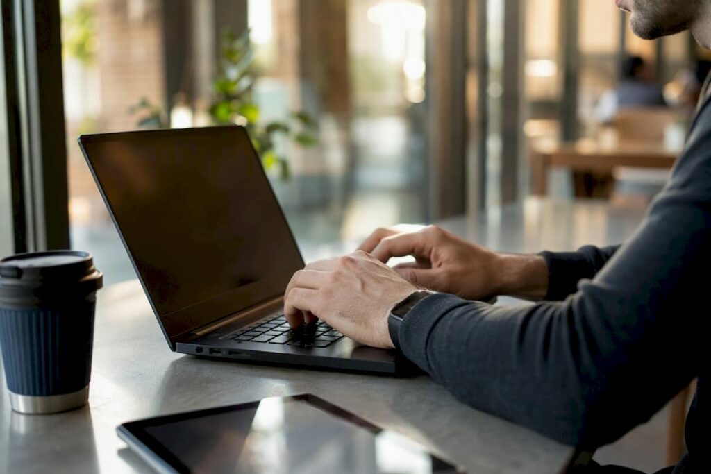 Developer typing mobile-first CSS at desk