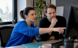 Specialists reviewing a website redesign audit