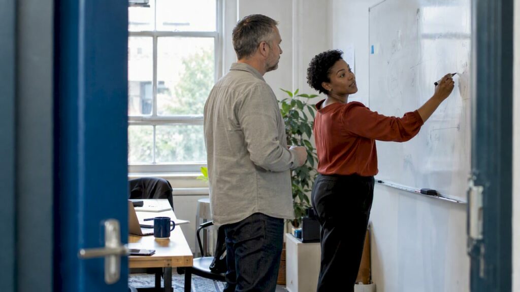 Founder and agency lead test a strategy workshop